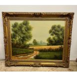 An oil on canvas of an landscape, signed bottom right in a gilt frame