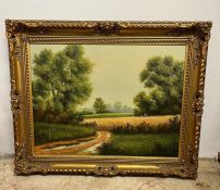 An oil on canvas of an landscape, signed bottom right in a gilt frame