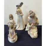 Three figures, Lladro, Nao and one other