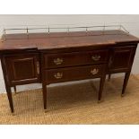 A Sheraton style sideboard with raised brass gallery back, flanked with cupboards and drawers (H90cm
