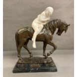 A bronze sculpture of The Pacing Horse with a marble lady astride titled Isabeau and signed by the