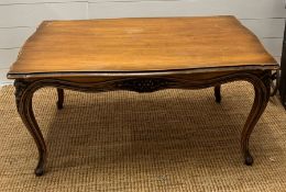 A coffee table on cabriole legs