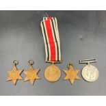 A selection of WWII Medals to include The Africa Star, The War Medal, 1939-45 Star, The Pacific Star