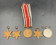 A selection of WWII Medals to include The Africa Star, The War Medal, 1939-45 Star, The Pacific Star