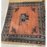 A Geometric orange grounds rug (SQ143cm)