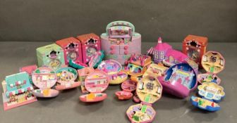 An extensive selection of Polly Pocket toys to include clocks and make up case