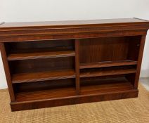 A mahogany double open bookcase stand upon a plinth base (H92cm W52cm D35cm)