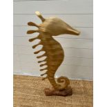 A sea horse sculpture on plinth