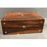A Victorian rosewood and mother of pearl work box with the hinged lid opening to a lined interior