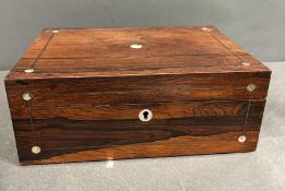 A Victorian rosewood and mother of pearl work box with the hinged lid opening to a lined interior