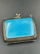 A silver and blue enamel coin purse marked MBros and hallmarked for Birmingham 1911.