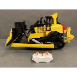 A Lego Technics radio controlled model of a bulldozer