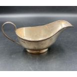 A silver sauce boat by Stower & Wragg Ltd hallmarked for Sheffield 1933