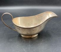 A silver sauce boat by Stower & Wragg Ltd hallmarked for Sheffield 1933