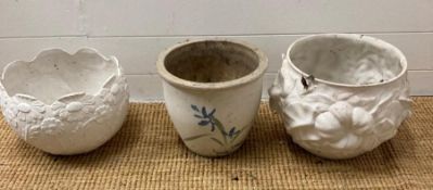 A selection of three white garden planters