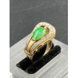 A 14ct gold ring with central Jade stone Size M