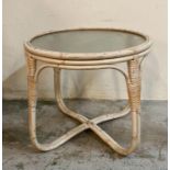 A vintage Boko rattan cane coffee table with glass top