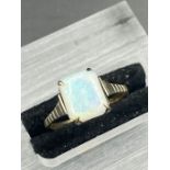 A 9ct gold and opal ring