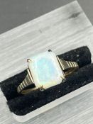 A 9ct gold and opal ring