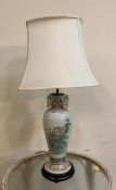 A Chinese style table lamp with floral motif