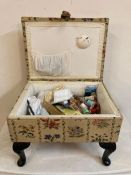 A floral upholstered sewing box or foot stool on mahogany cabriole legs