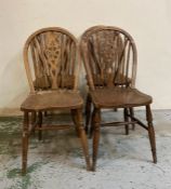 Four oak vintage wheel back dining chairs