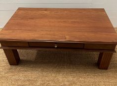 A hardwood coffee table with drawer to centre (H48cm W130cm D74cm)