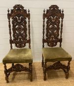 A pair of oak Victorian carved hall chairs circa 1880