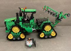 A Lego Technic radio controlled tractor with plough