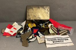 A volume of WWII era insignia and military patches for the German and the British Armies (some