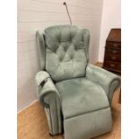 A willowbrook electric reclining arm chair with reading light and storage compartment