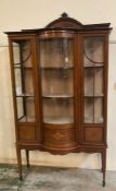 An Edwardian Sheraton revival style inlaid centre bow fronted display cabinet (H210cm W110cm D42cm)