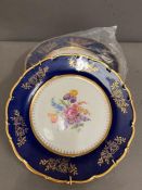 Three cobalt blue floral plates