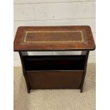 A leather top newspaper/magazine rack