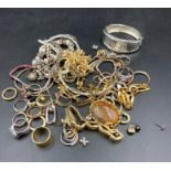 A large selection of drees and costume jewellery to include rings,