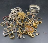 A large selection of drees and costume jewellery to include rings,