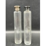 Two glass perfume bottles, one with a hallmarked silver top