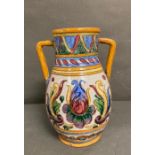 A Studio Pottery two handled vase with floral decoration