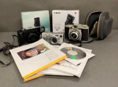 A selection of cameras to include Canon Ixus and Kodak Brownie
