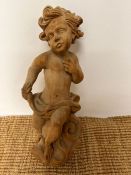 A carved wooden wall hanging cherub (H50cm)