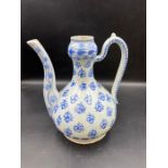 A porcelain ewer painted in cobalt blue underglaze