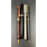 A small selection of four pens including a Parker Fountain pen