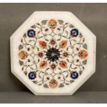 An octagonal inlaid marble chopping board or table top (31cm)