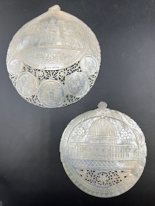 Two carved and pierced mother of pearl shells (Dia 14.5cm Dia12cm)