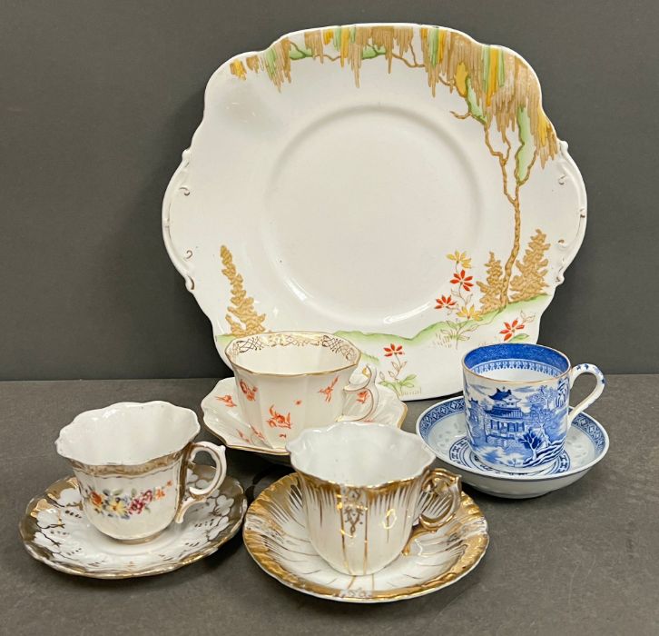 A selection of porcelain tea cups and saucers and sandwich plates, various makers