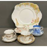 A selection of porcelain tea cups and saucers and sandwich plates, various makers