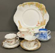 A selection of porcelain tea cups and saucers and sandwich plates, various makers