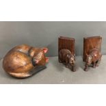 A carved wooden bookends and a carved wooden cat