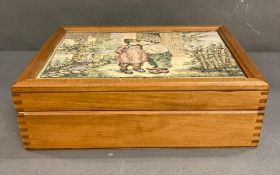 A large wooden jewellery or trinket box with embroidered lid