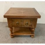 A light oak single drawer side table